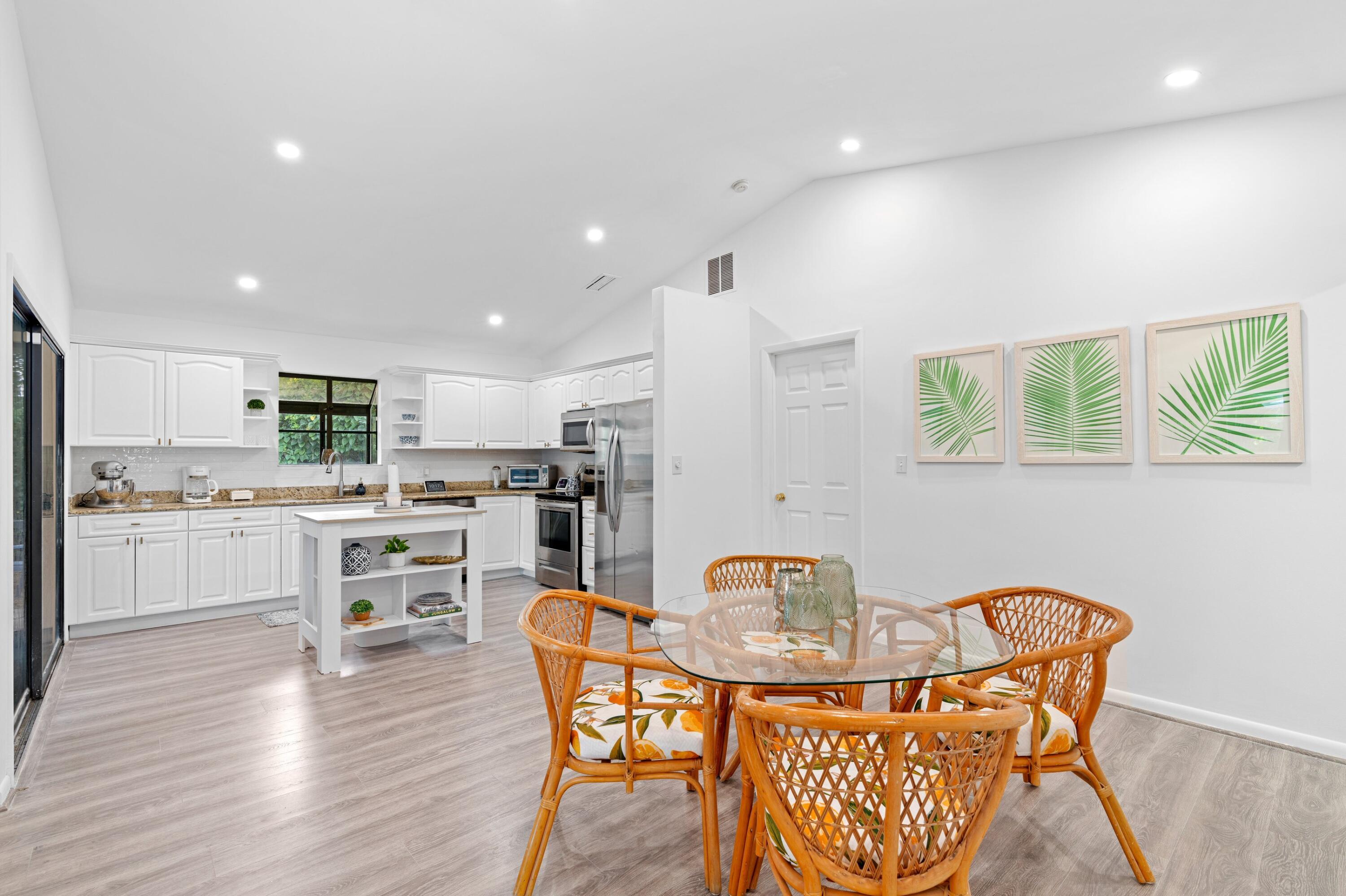 6894 Southeast Raintree Avenue Stuart, FL 34997 - Photo 5 of 24 Flow Through Kitchen and Dining