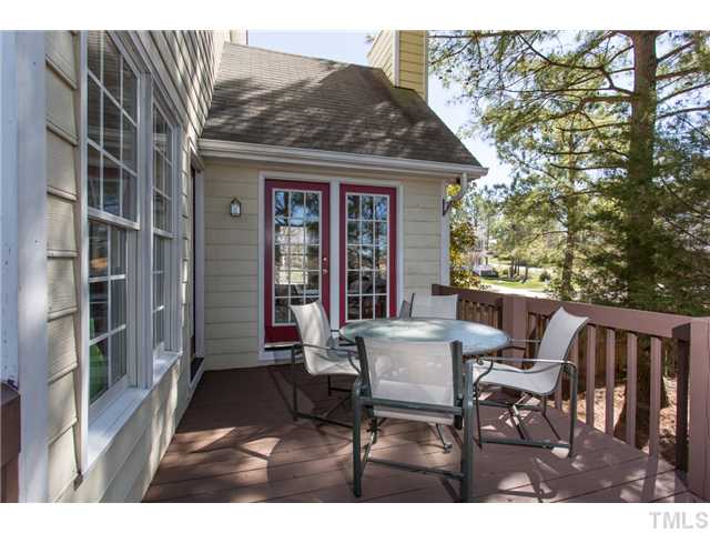 3205 Leebrook Road Raleigh, NC 27616 - Photo 7 of 11 a view of a patio with table and chairs and wooden floor