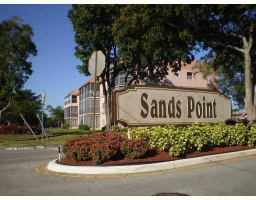 8310 Sands Point Boulevard, Unit 103L Tamarac, FL 33321 - Photo 11 of 12 Exterior Front
