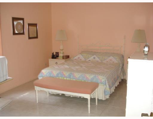 8310 Sands Point Boulevard, Unit 103L Tamarac, FL 33321 - Photo 3 of 12 Master Bedroom