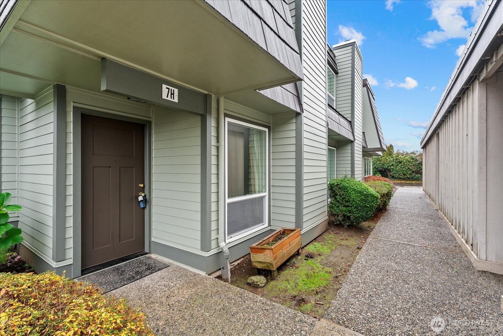 12600 4th Avenue West, Unit 7H Everett, WA 98204 - Photo 1 of 30 a view of a house with backyard and porch