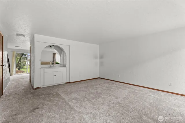 a view of a kitchen with refrigerator and stove