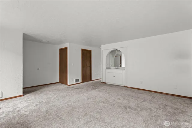 a kitchen with stainless steel appliances a refrigerator sink and cabinets