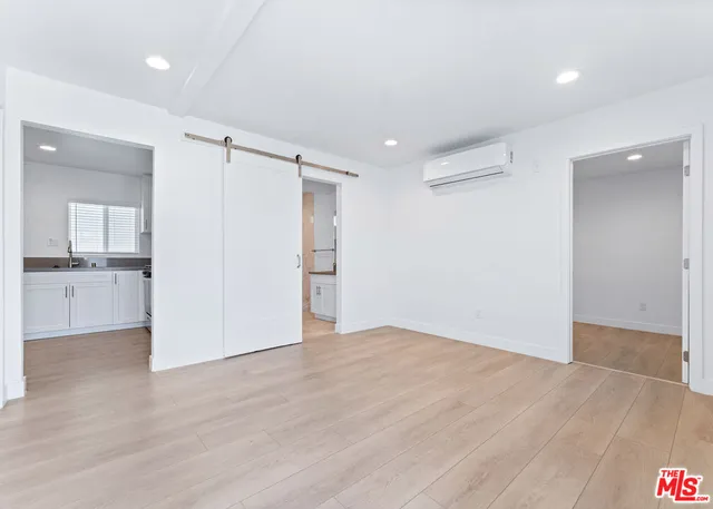 a bathroom with a granite countertop sink mirror and shower