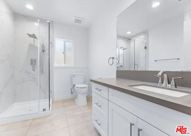 a view of a street with cars