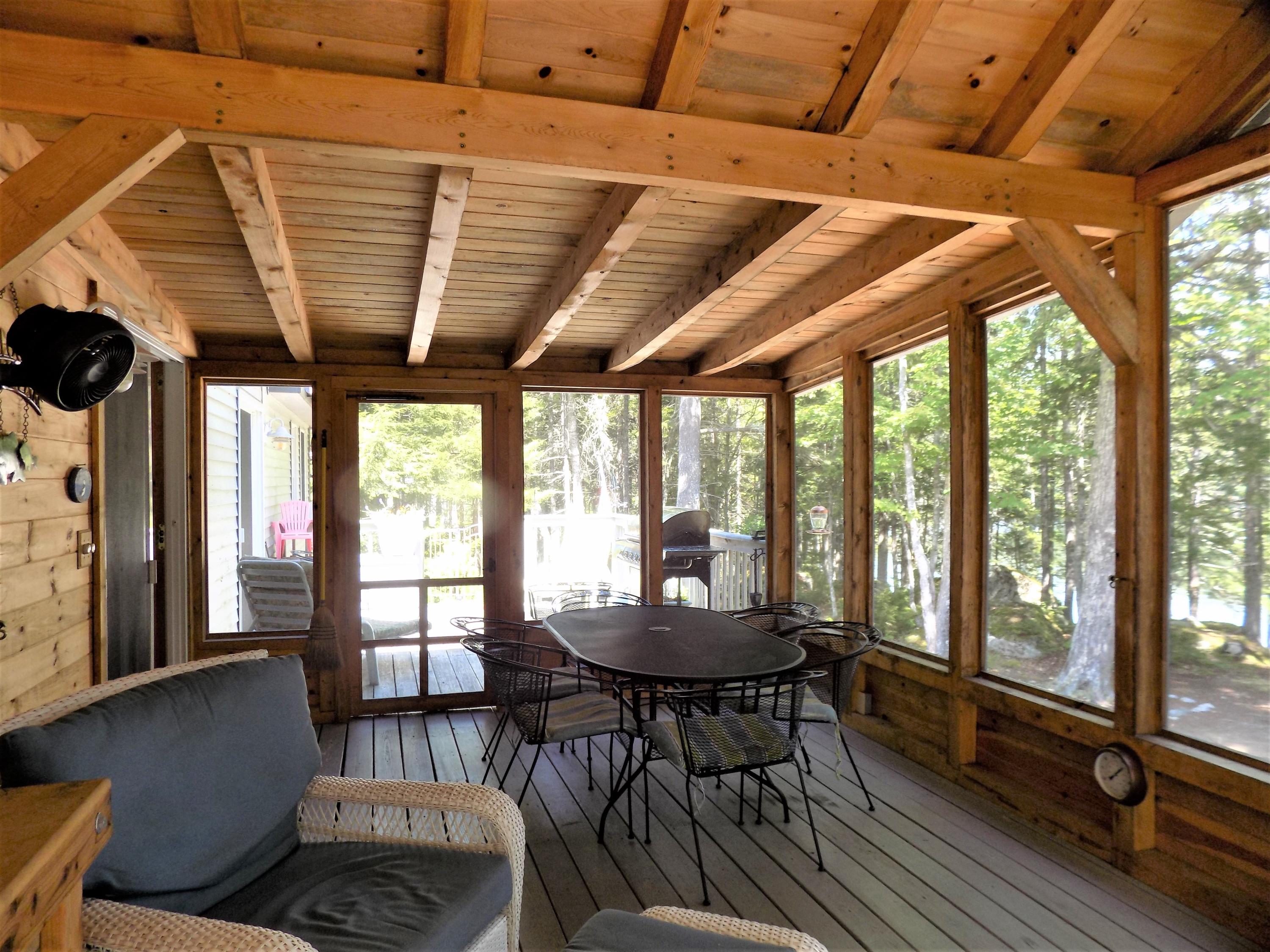 171 Long Point Way Orland, ME 04472 - Photo 17 of 63 Screened porch opens to the deck