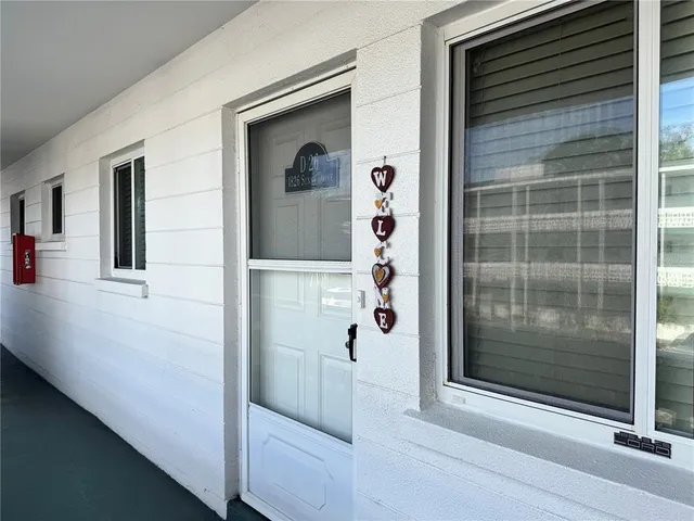 a view of a door and a window