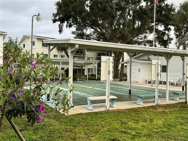 a view of a house with backyard and porch