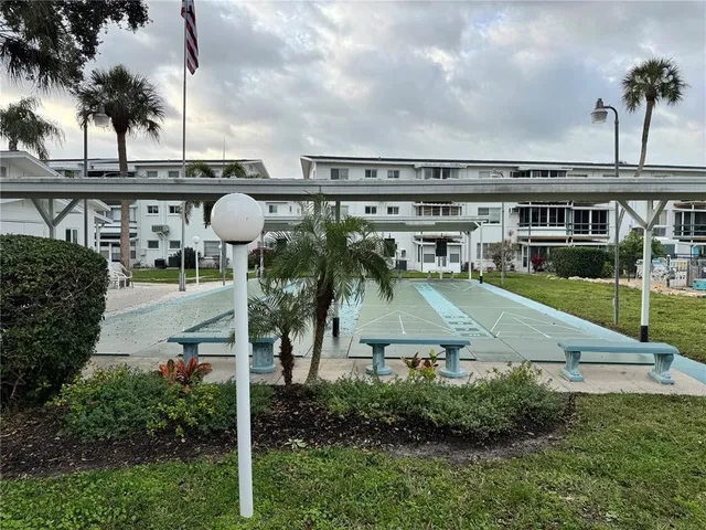 an aerial view of a house with garden space and street view