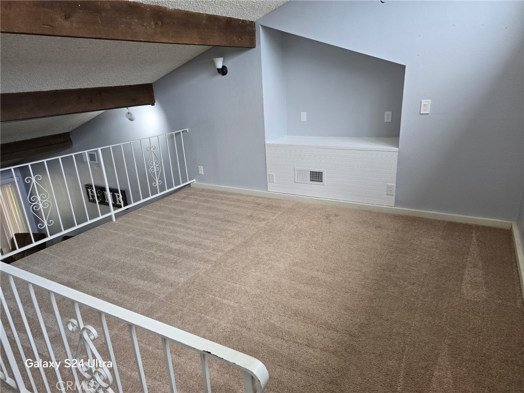 11504 Los Molinos Way Riverside, CA 92505 - Photo 16 of 40 a view of an empty room with stairs and a window