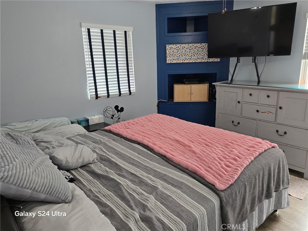11504 Los Molinos Way Riverside, CA 92505 - Photo 19 of 40 a bedroom with a bed and window