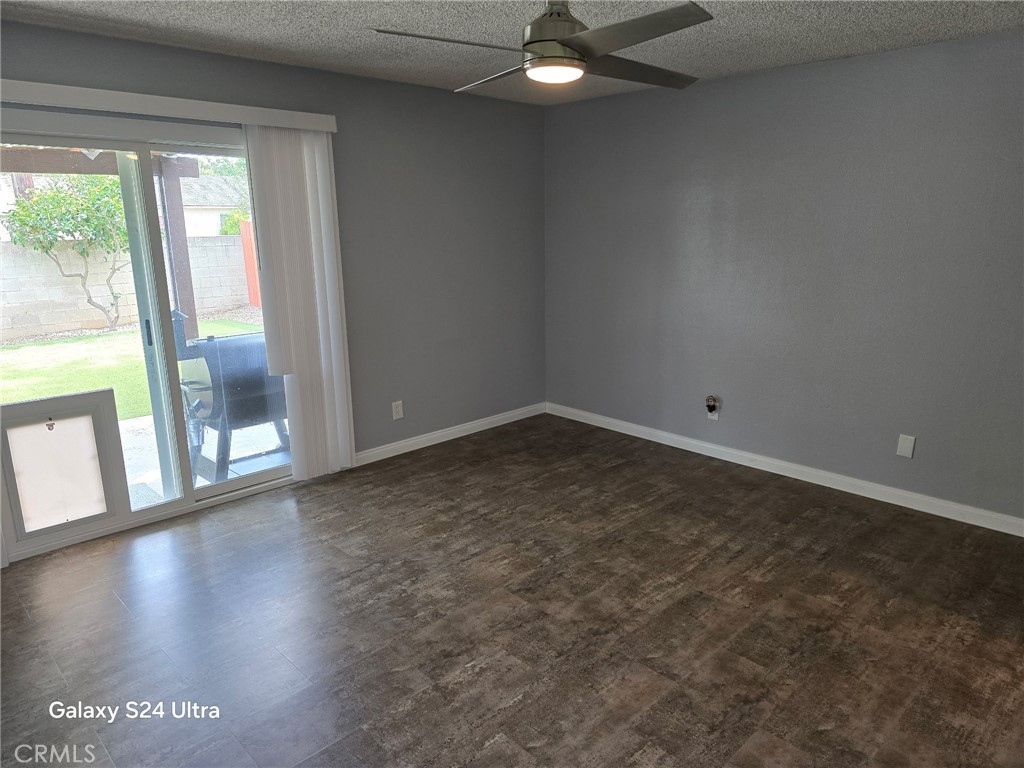 11504 Los Molinos Way Riverside, CA 92505 - Photo 23 of 40 an empty room with wooden floor and windows