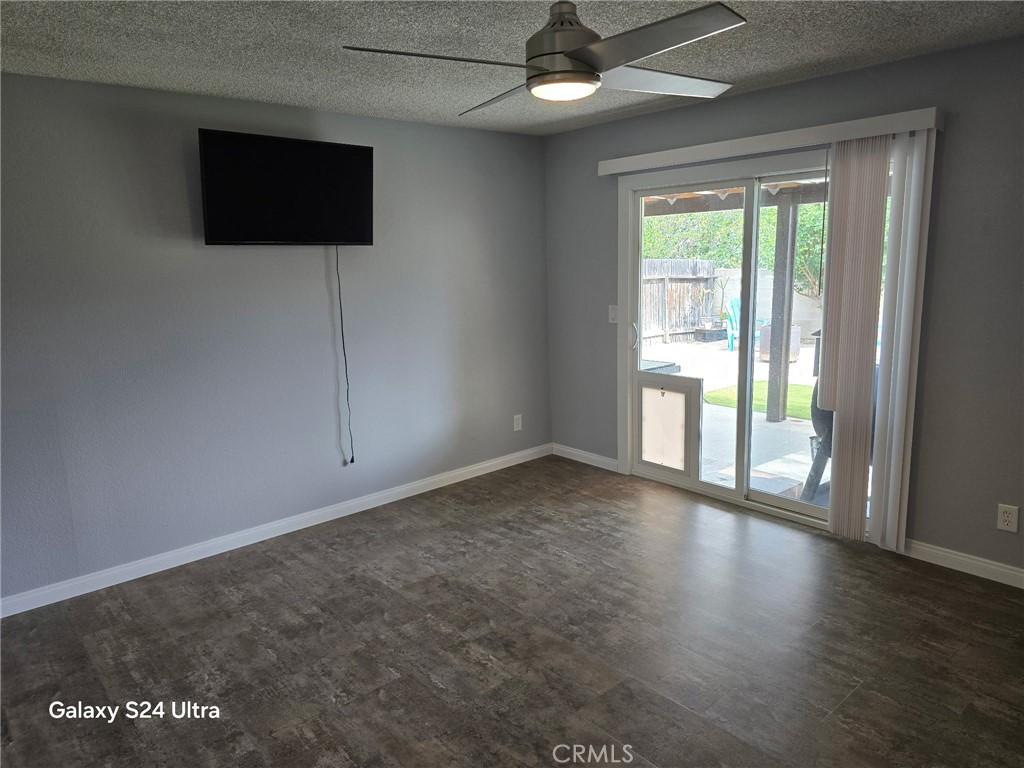 11504 Los Molinos Way Riverside, CA 92505 - Photo 25 of 40 an empty room with wooden floor and windows