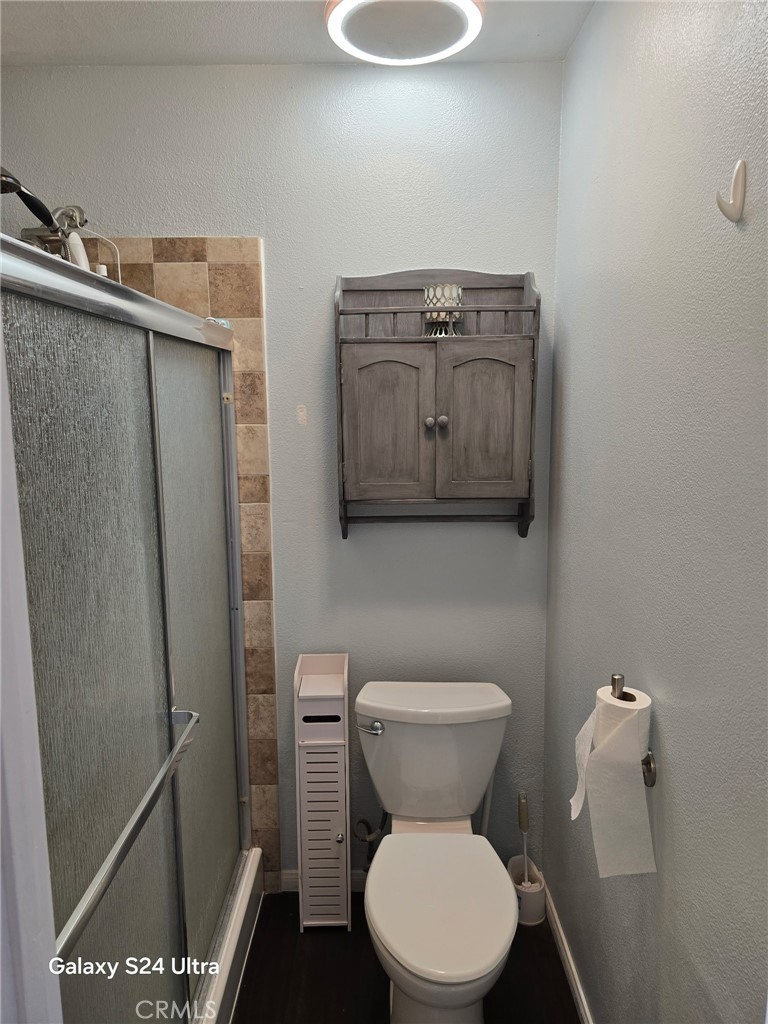 11504 Los Molinos Way Riverside, CA 92505 - Photo 28 of 40 a white toilet sitting next to a bathroom sink