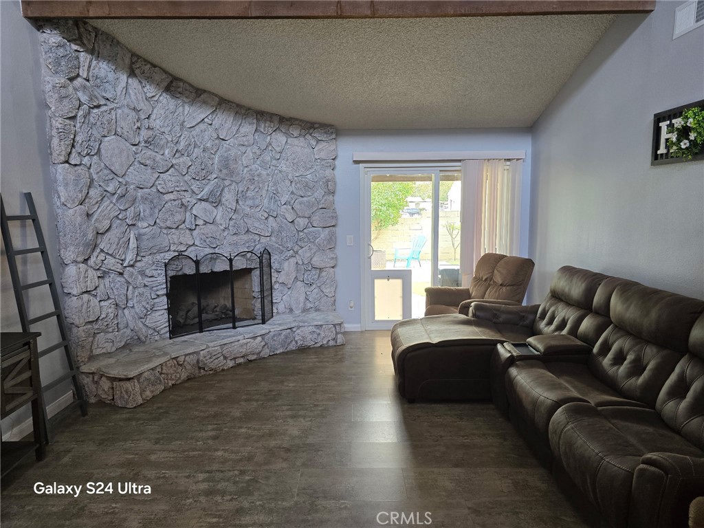 11504 Los Molinos Way Riverside, CA 92505 - Photo 4 of 40 a living room with furniture and a fireplace