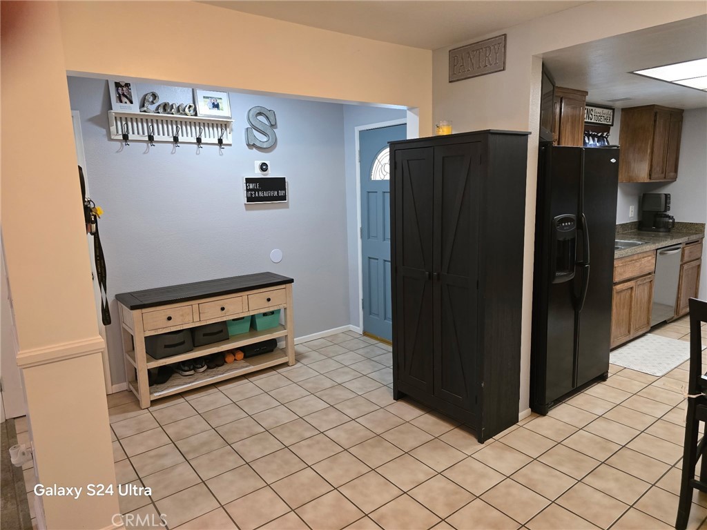 11504 Los Molinos Way Riverside, CA 92505 - Photo 7 of 40 a kitchen with stainless steel appliances a refrigerator and a stove