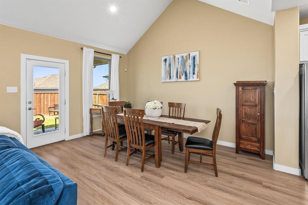 4017 Mapleleaf Pass Melissa, TX 75454 - Photo 11 of 32 a view of a dining room with furniture and wooden floor