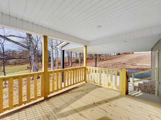 a house that has a tree in front of it