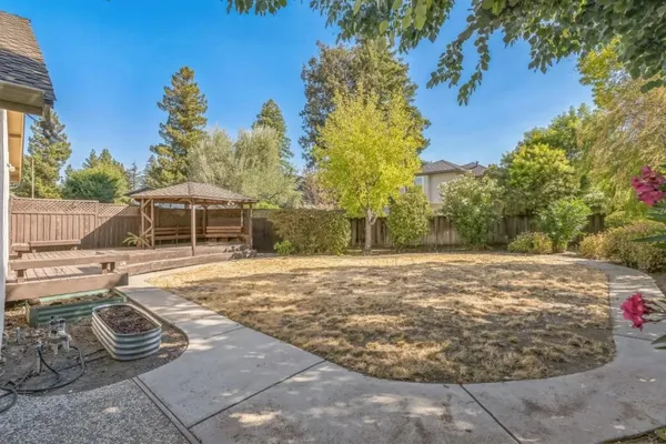 a view of a swimming pool with a yard