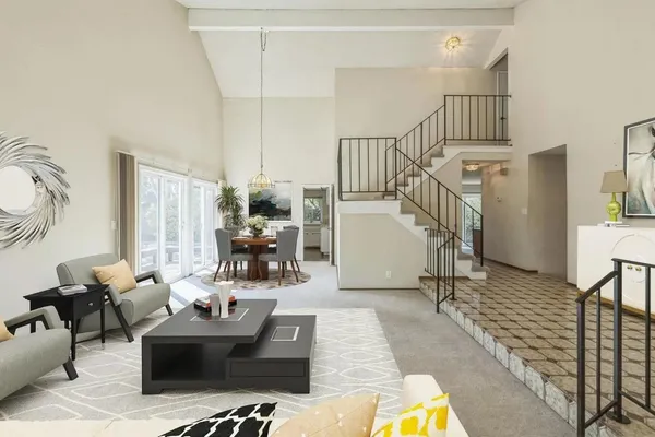 a living room with furniture fireplace and rug floor