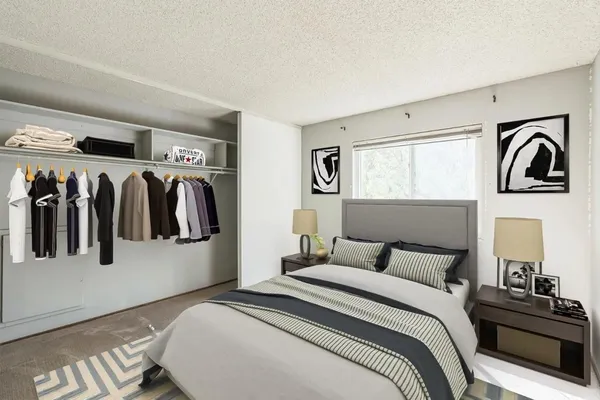 a bedroom with a bed and a walk in closet