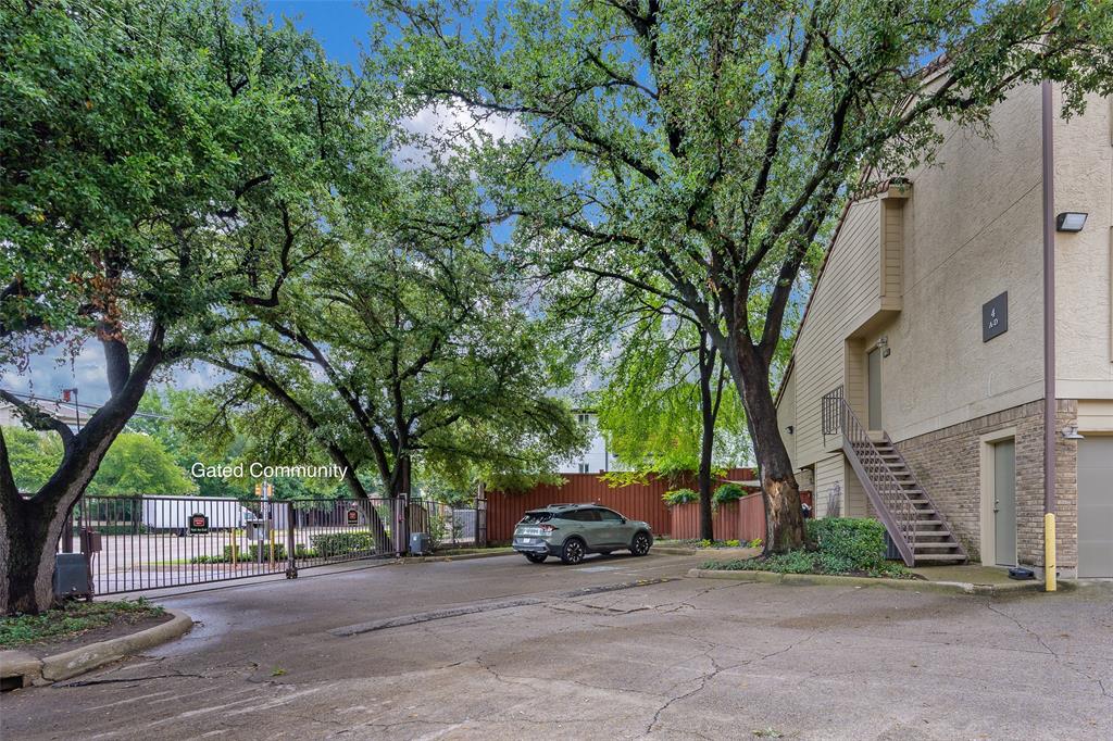 4777 Cedar Springs Road, Unit 7P Dallas, TX 75219 - Photo 16 of 21 a view of a cars parked on a street