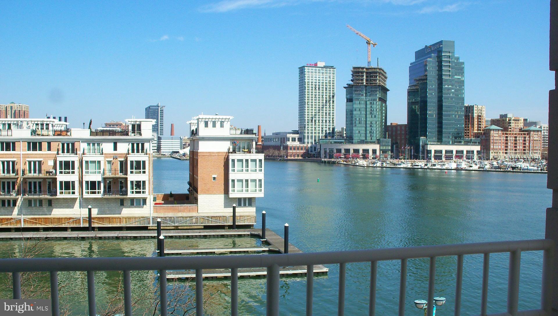 100 Harborview Drive, Unit 513 Baltimore, MD 21230 - Photo 33 of 58 a view of a lake with tall buildings
