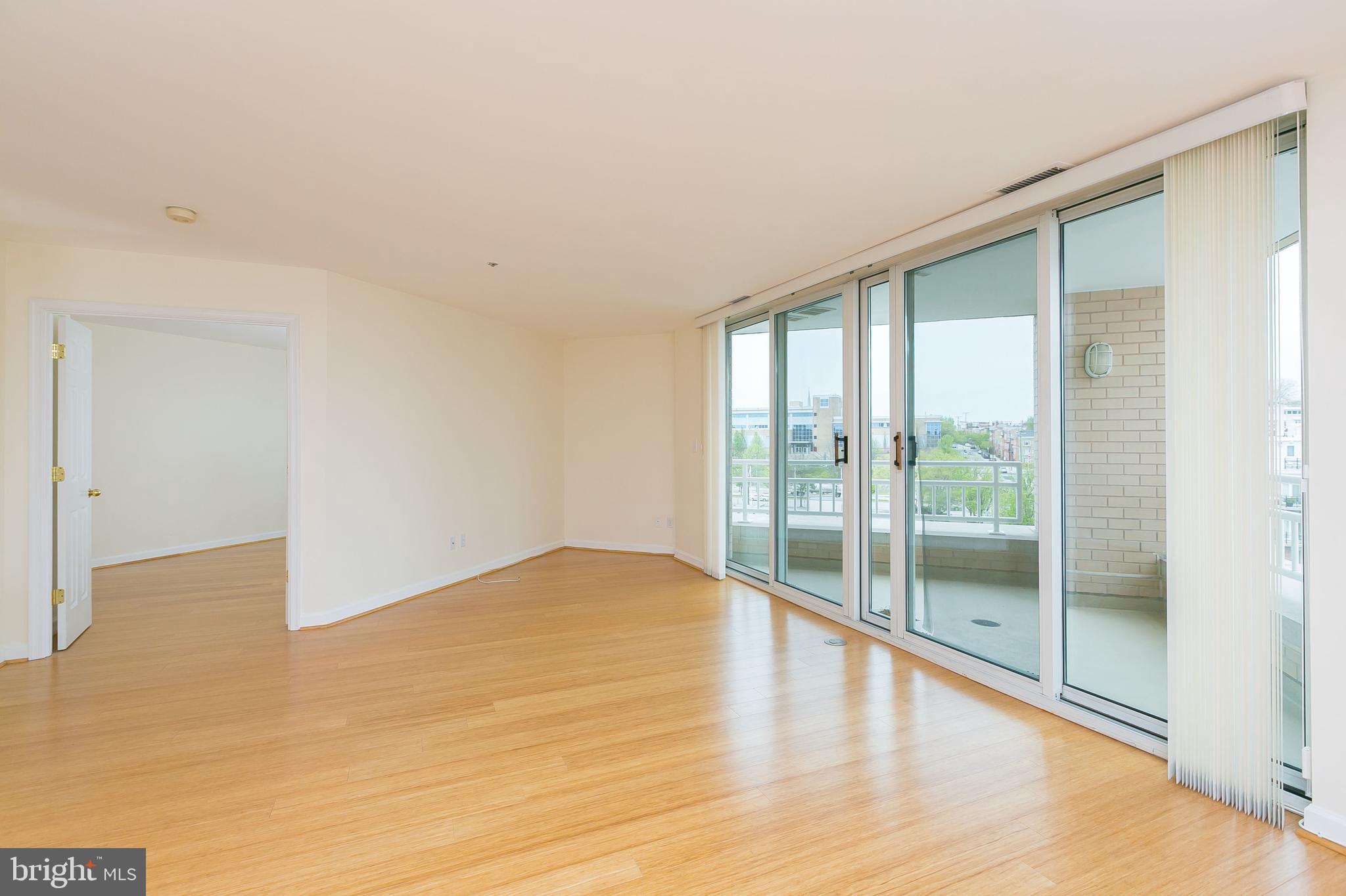 100 Harborview Drive, Unit 513 Baltimore, MD 21230 - Photo 6 of 58 a view of empty room with wooden floor and fan