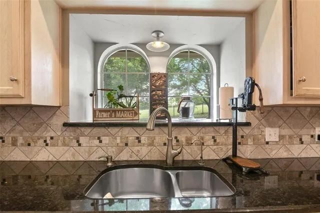 a view of a sink and a window