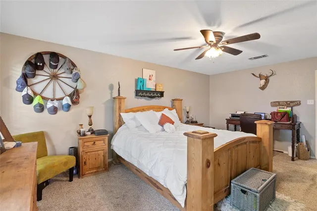 a bedroom with bed and window