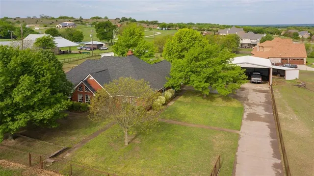 an aerial view of a house with a garden