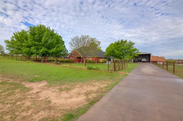 a view of a park with large trees