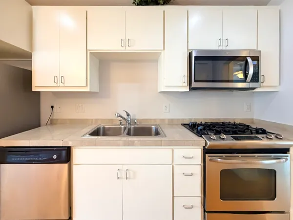 a kitchen with a stove and a sink