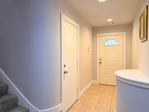 a view of a hallway with bathroom