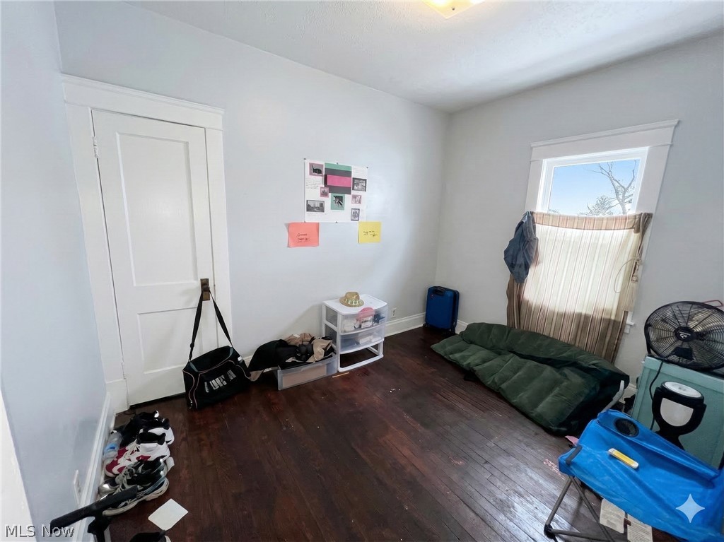 10112 Aetna Road Cleveland, OH 44105 - Photo 5 of 31 Bedroom with dark wood-type flooring and baseboards
