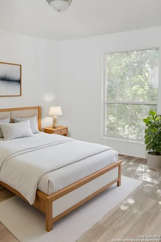 a bedroom with a bed and window