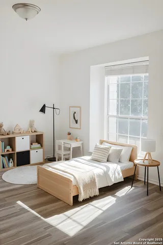 a spacious bedroom with a bed and a window