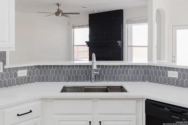 a kitchen with a sink and a window