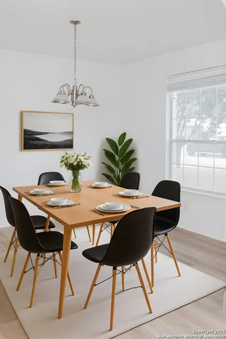 a view of a dining room with furniture and window