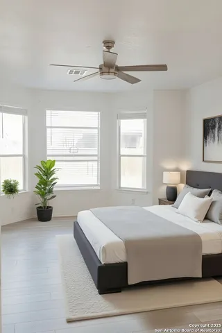 a bedroom with a bed and window