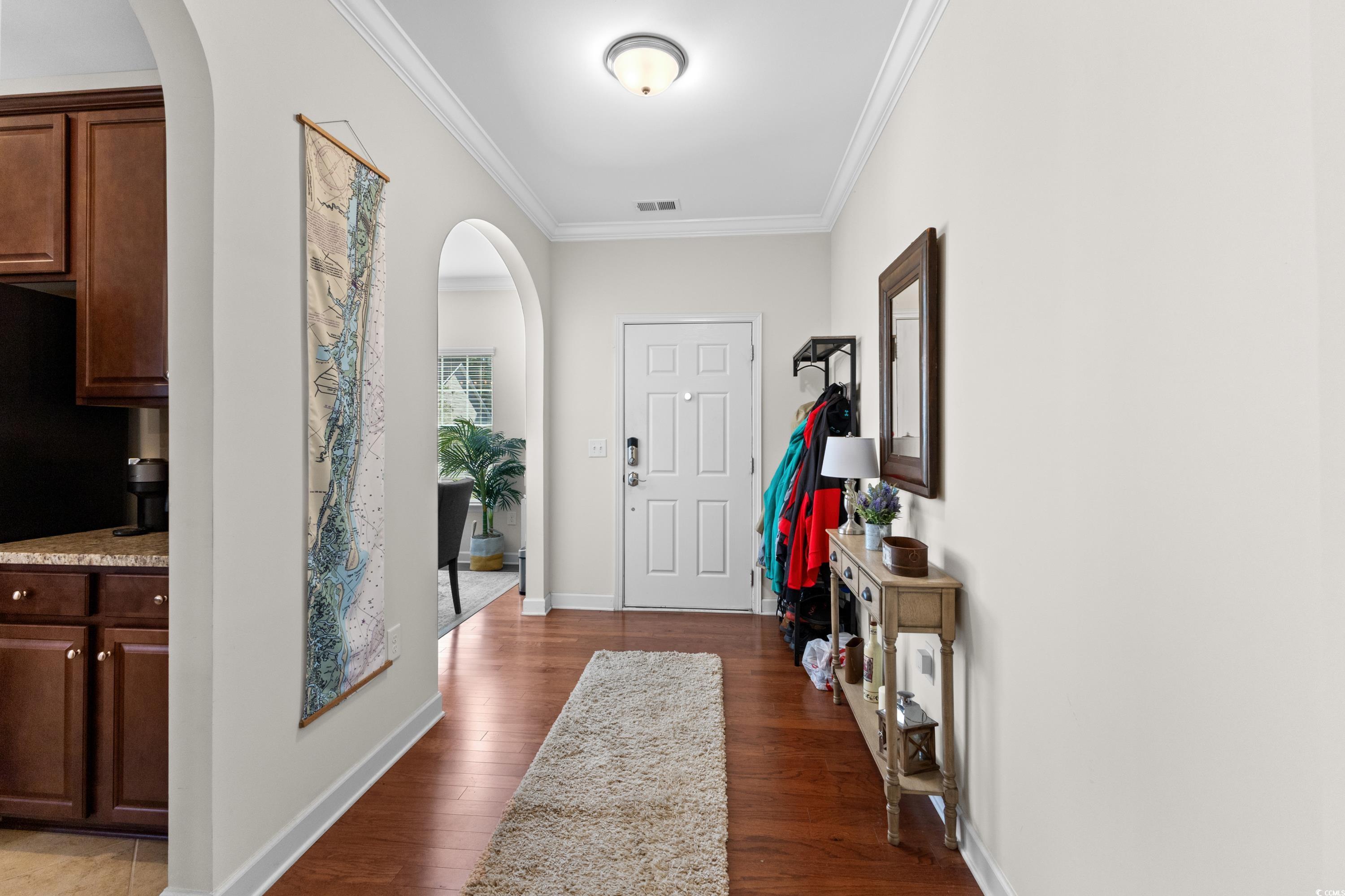 354 Ridge Point Drive Conway, SC 29526 - Photo 3 of 37 Foyer entrance with ornamental molding and dark ha