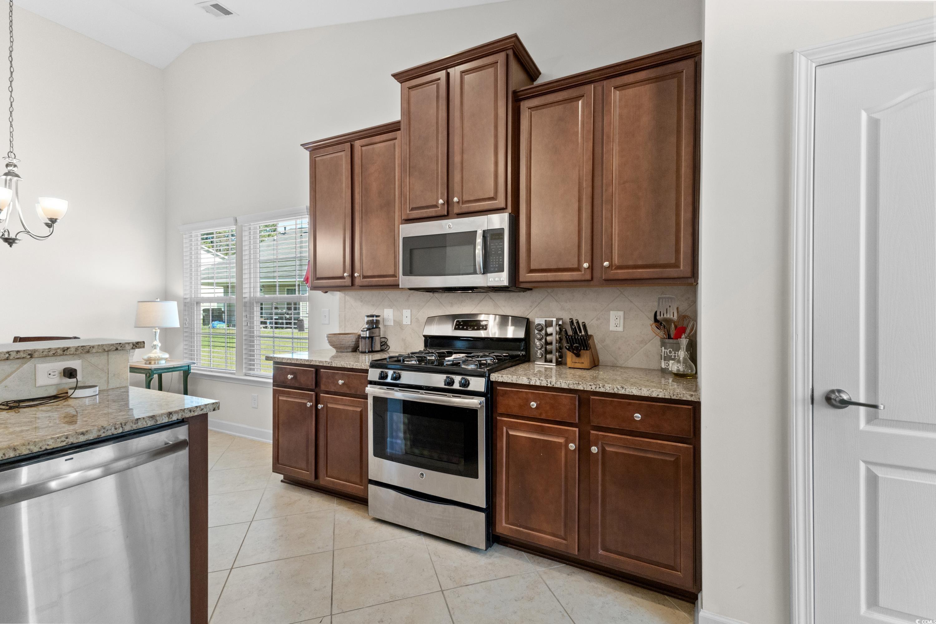 354 Ridge Point Drive Conway, SC 29526 - Photo 8 of 37 Kitchen with lofted ceiling, light stone counterto