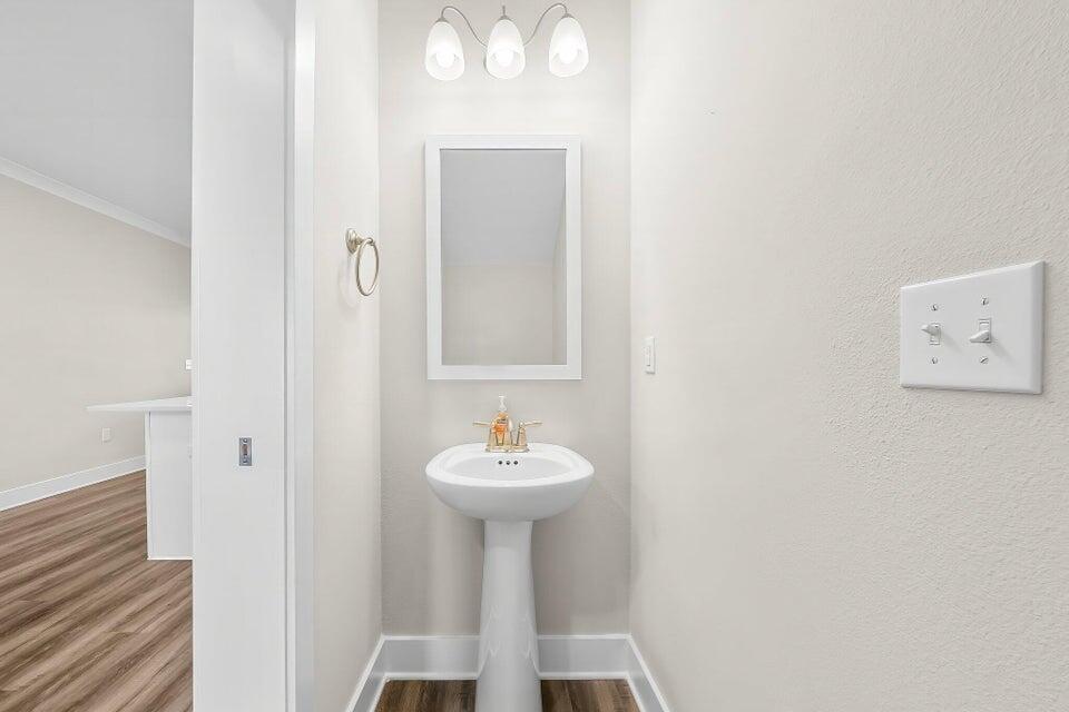 306 North Sand Palm Road, Unit VISTA Freeport, FL 32439 - Photo 14 of 44 a bathroom with a sink and a mirror