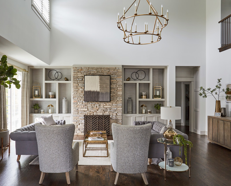 5585 Barton Lane Hinsdale, IL 60521 - Photo 2 of 20 a living room with furniture a fireplace and a chandelier