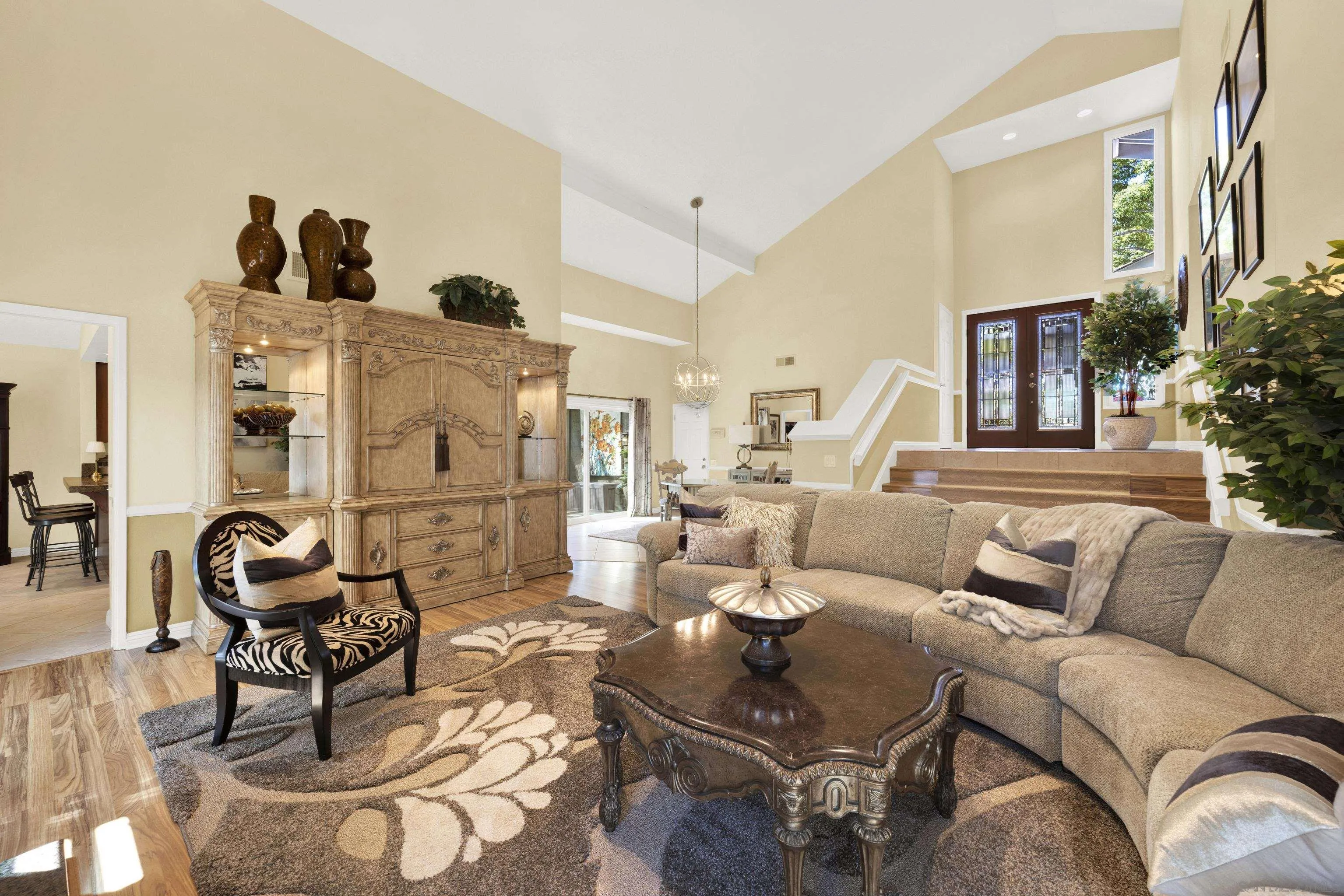 17233 Cuvee Court Poway, CA 92064 - Photo 12 of 53 a living room with furniture and a floor to ceiling window