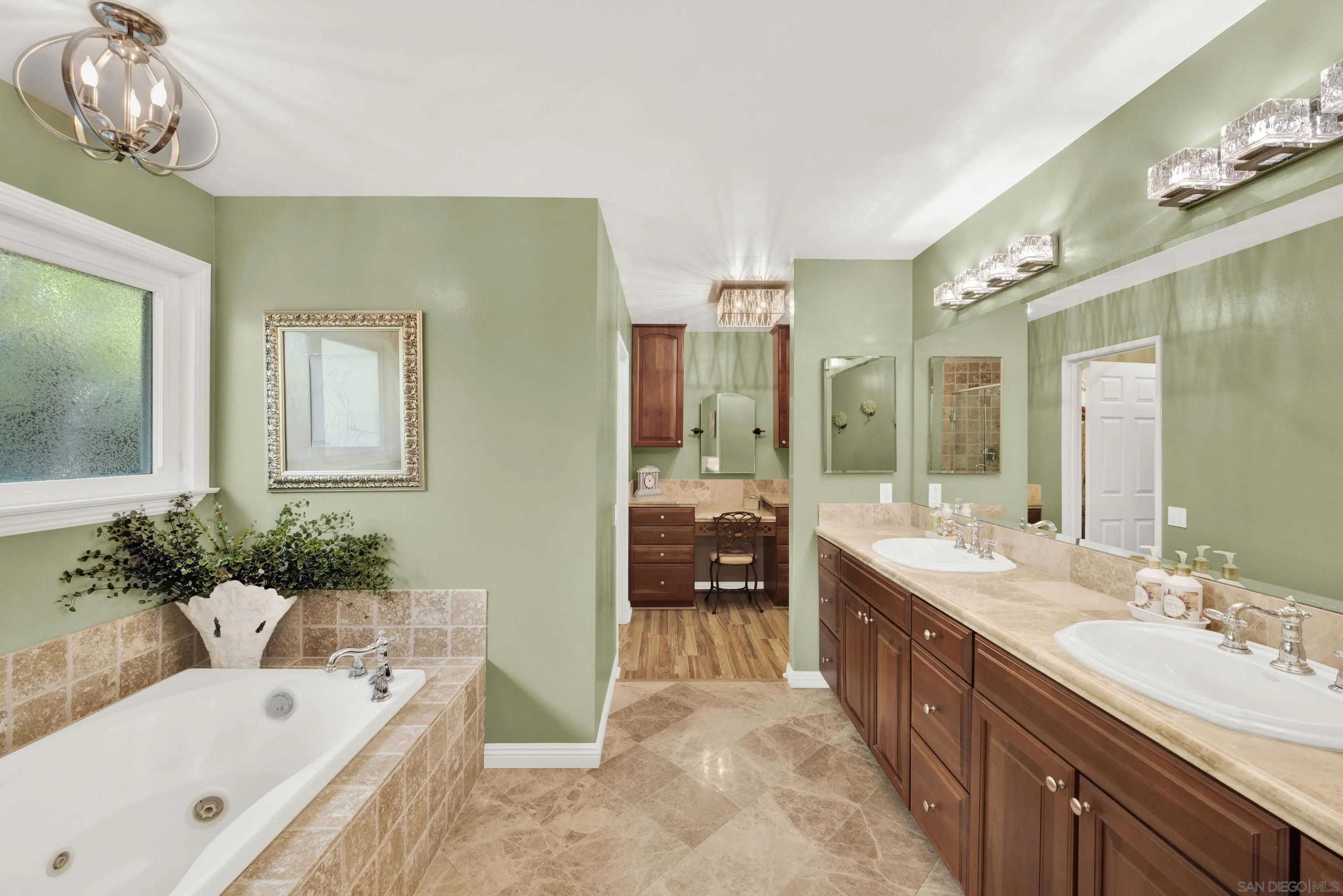17233 Cuvee Court Poway, CA 92064 - Photo 28 of 53 a spacious bathroom with a tub sink and mirror