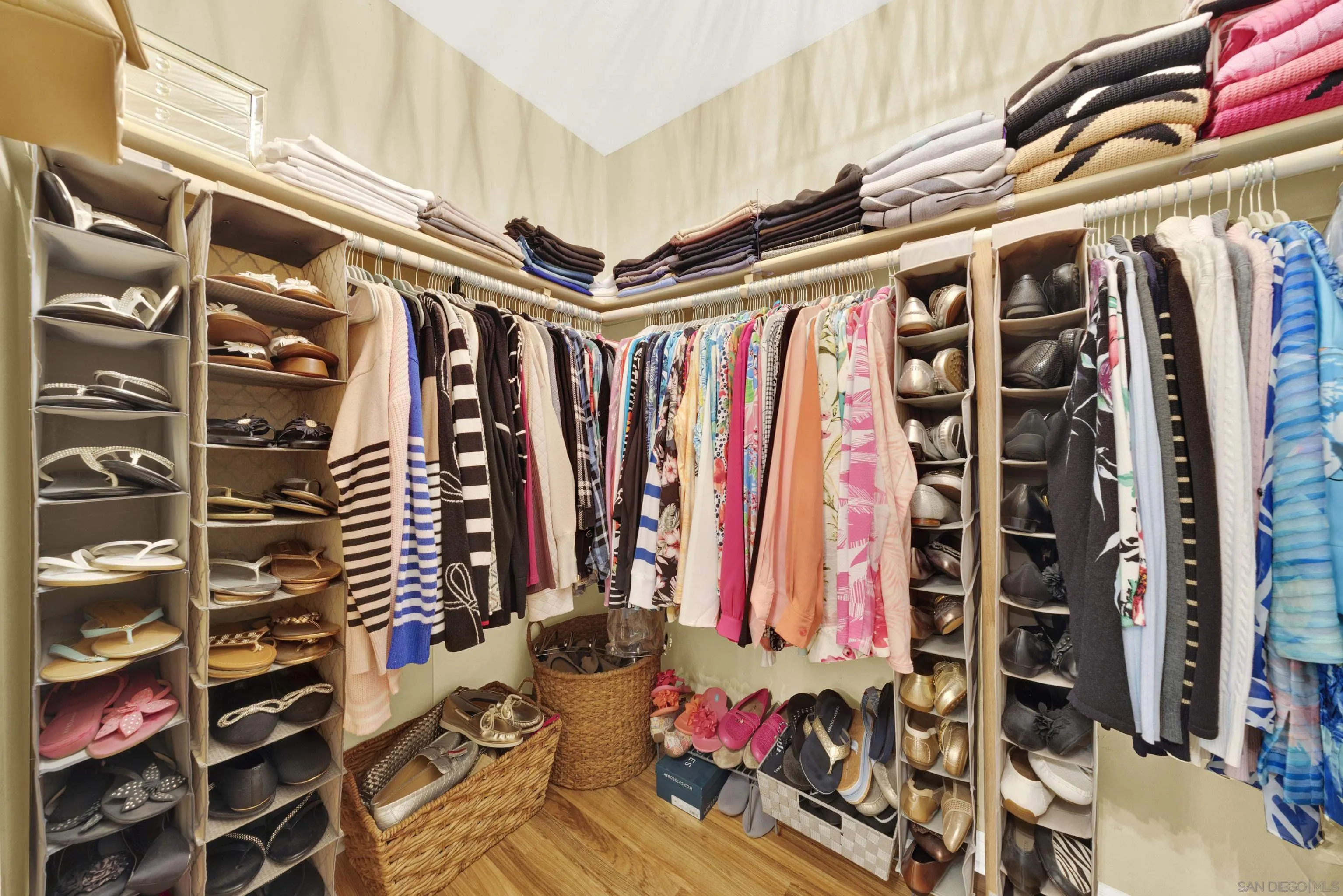 17233 Cuvee Court Poway, CA 92064 - Photo 30 of 53 a view of walk in closet with clothes