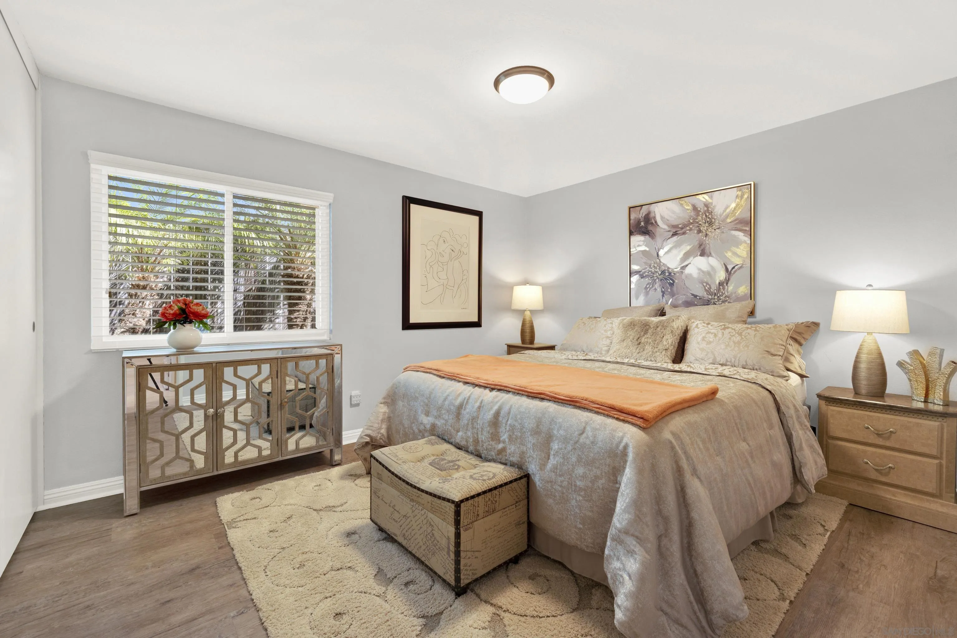 17233 Cuvee Court Poway, CA 92064 - Photo 34 of 53 a spacious bedroom with a bed and wooden floor