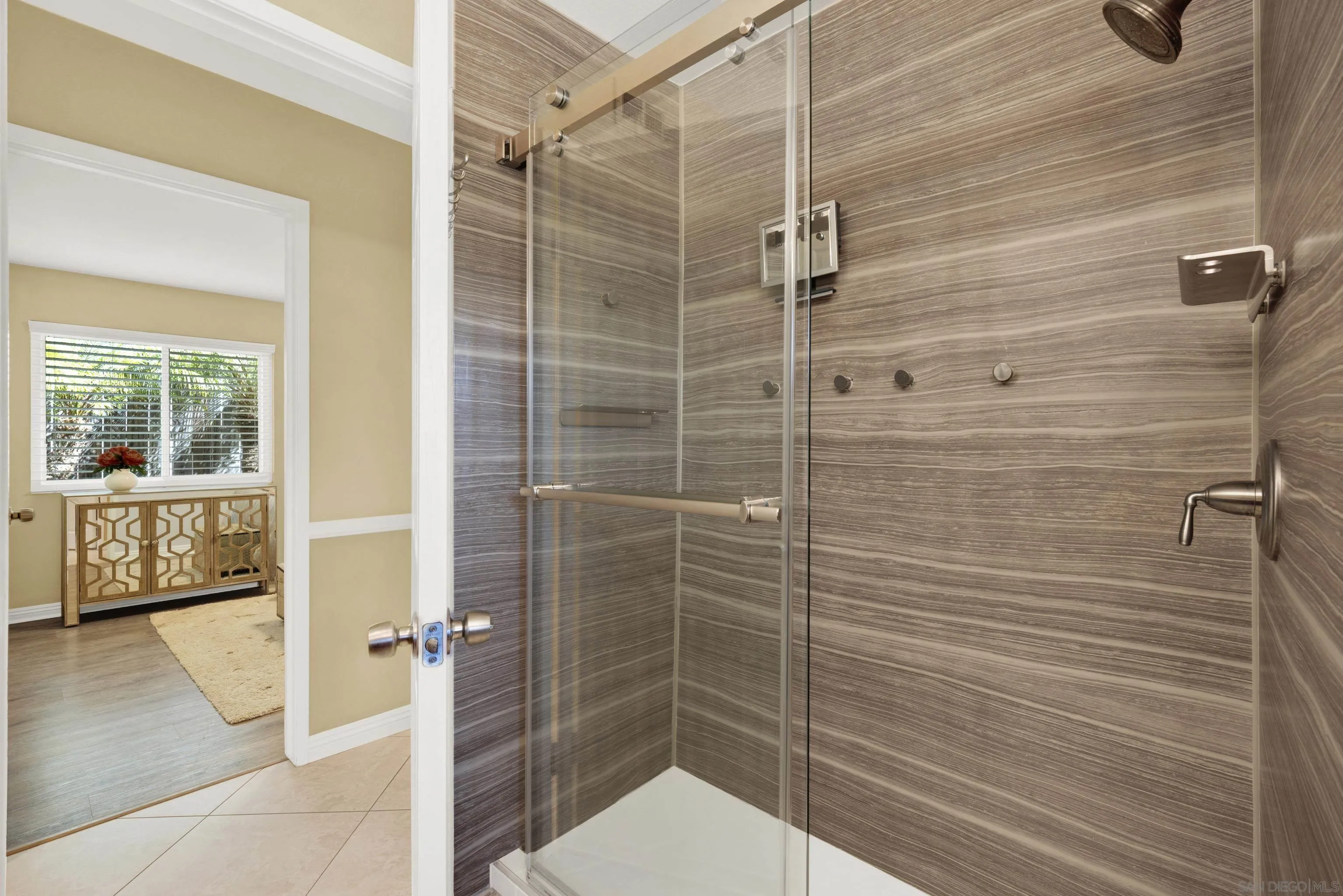 17233 Cuvee Court Poway, CA 92064 - Photo 35 of 53 a bathroom with a shower and a sink