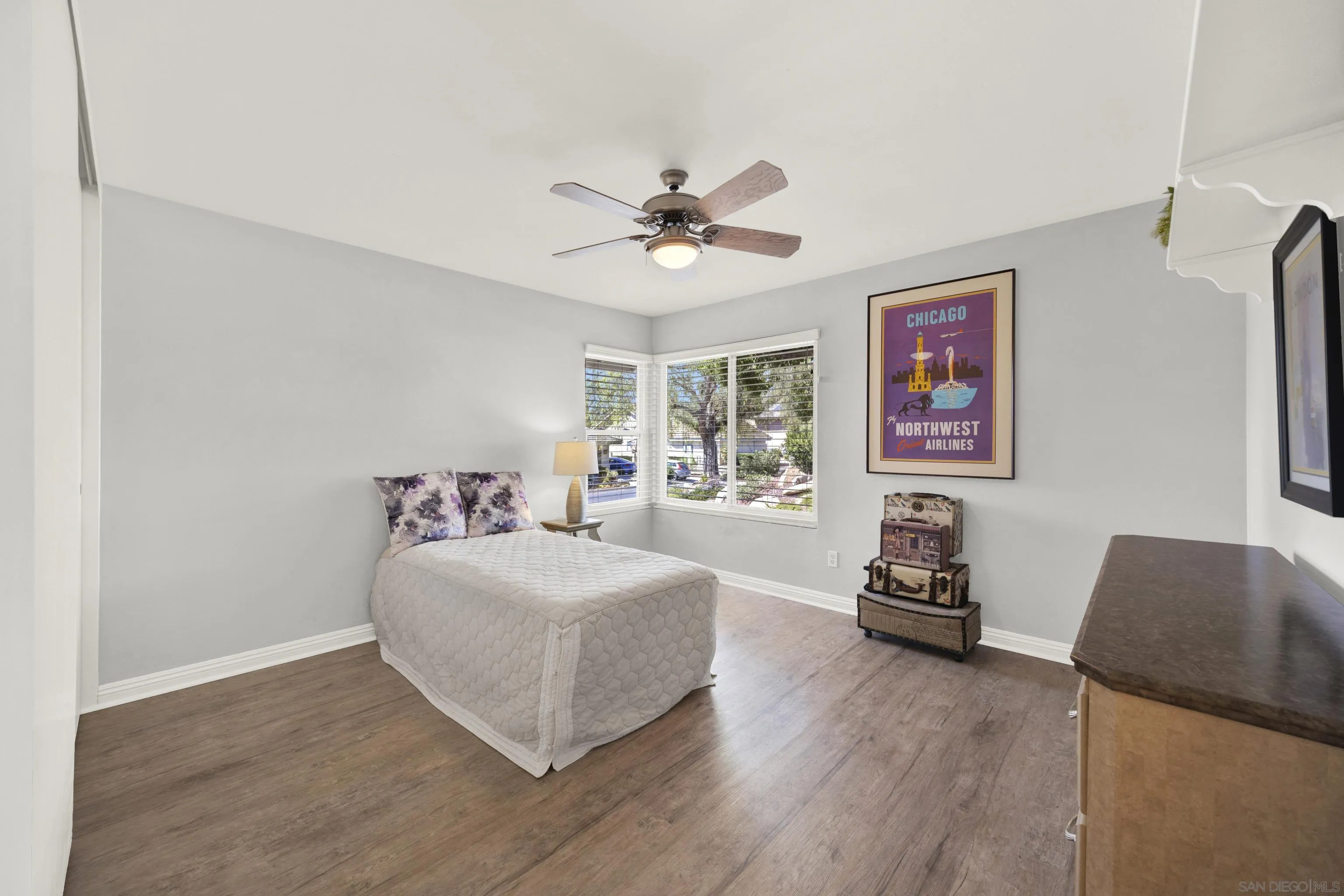 17233 Cuvee Court Poway, CA 92064 - Photo 38 of 53 a bedroom with a bed and a chandelier